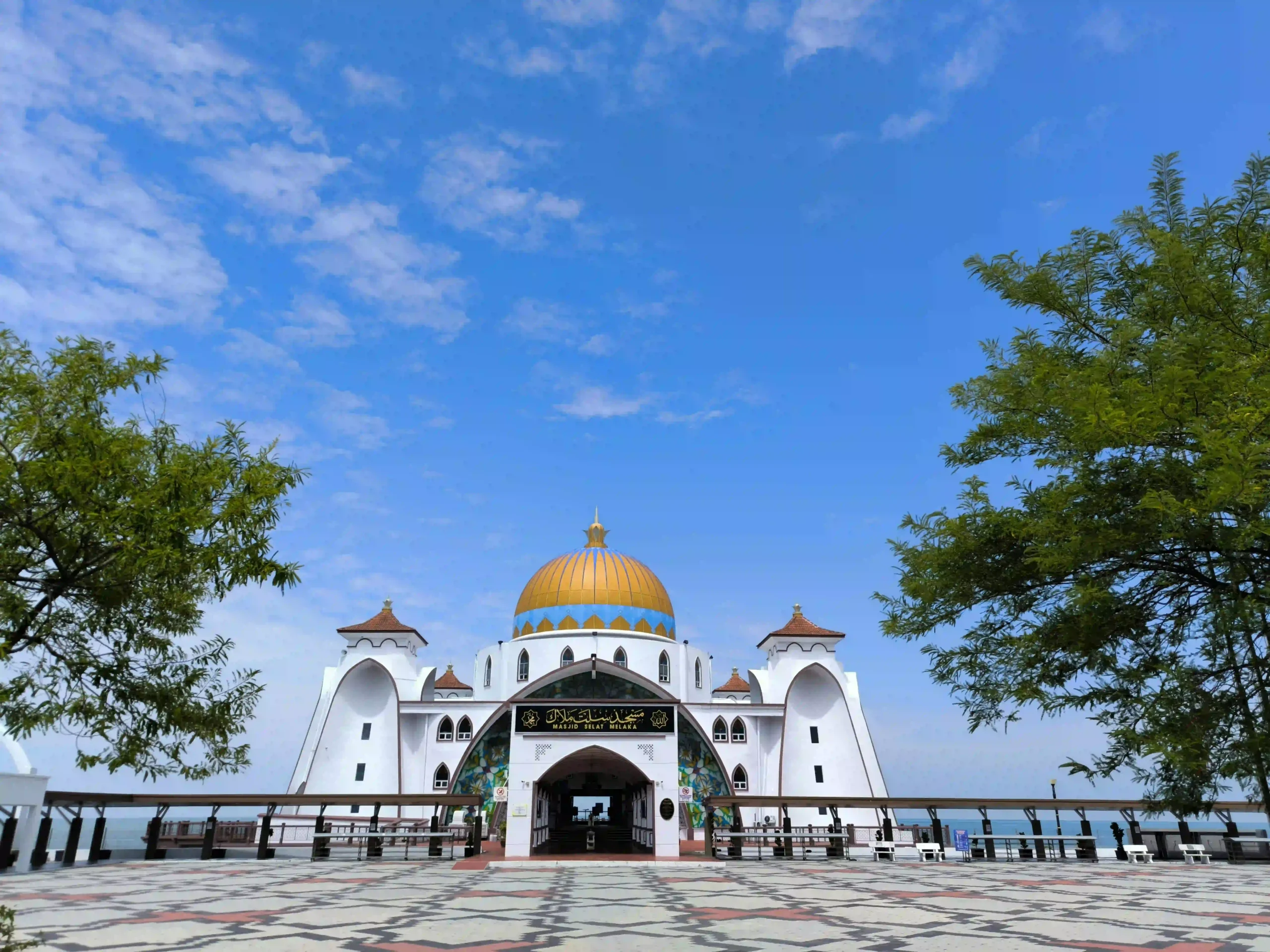 Malacca Straits Mosque in Melaka, Malaysia with golden dome near the sea