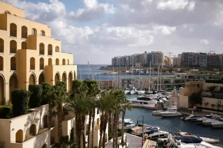 Malta marina with yachts and coastal buildings along the Mediterranean sea